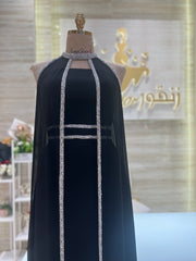 A shimmering, silver, sleeveless gown with a flowing skirt, perfect for a formal event.exclamation